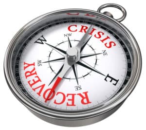 crisis versus recovery concept compass isolated on white background